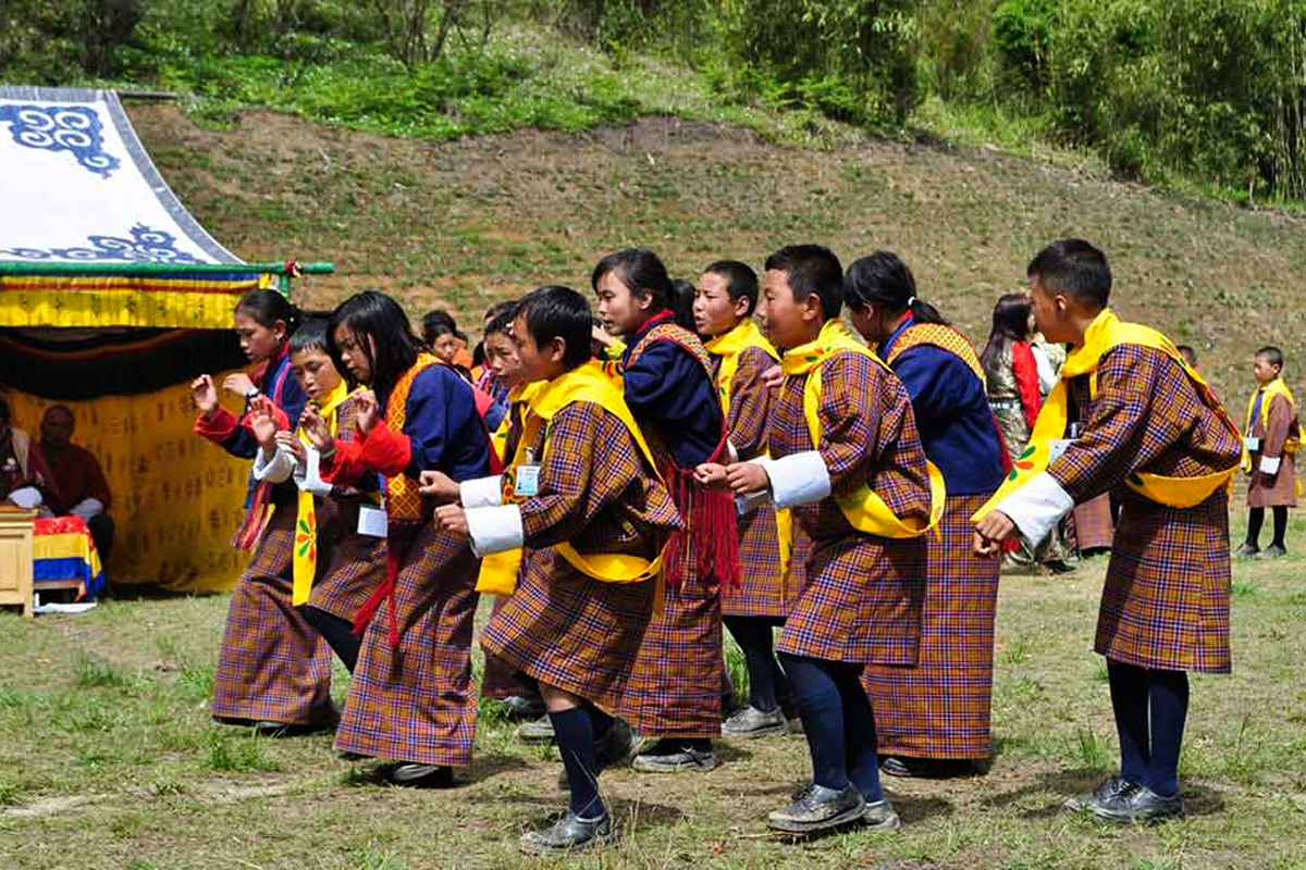 People performing dance during Rhododendron Festival in Bhutan